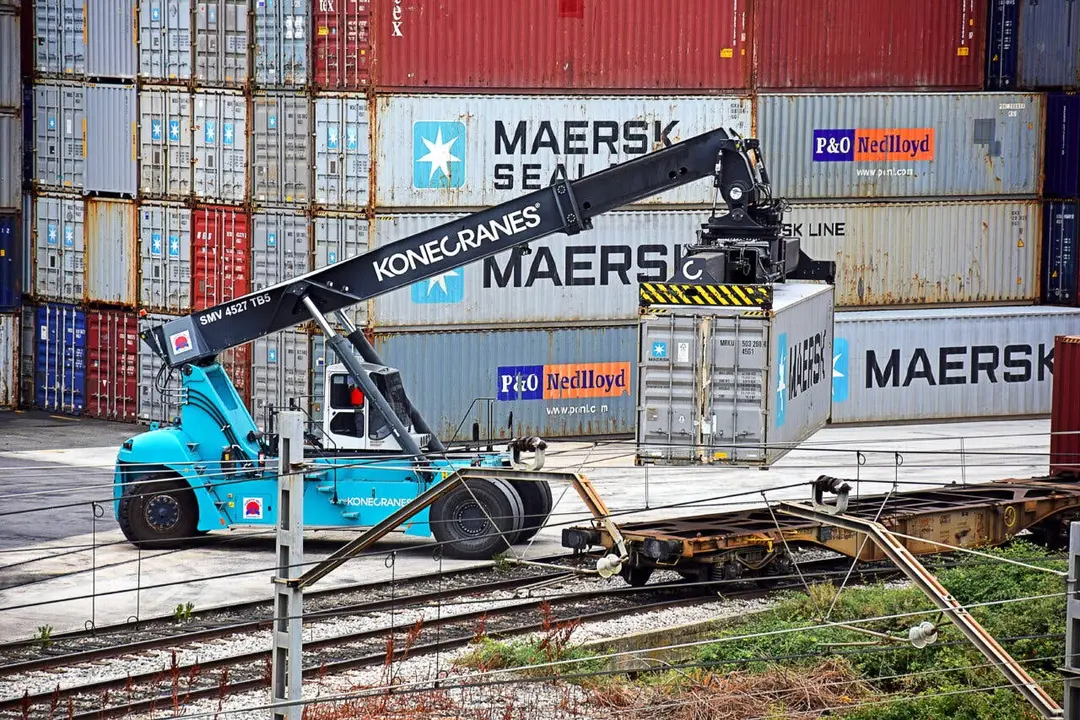 AZUQUECA DE HENARES, SPAIN - AUGUST 28, 2017: Man working with elevator vehicle for goods transport containers