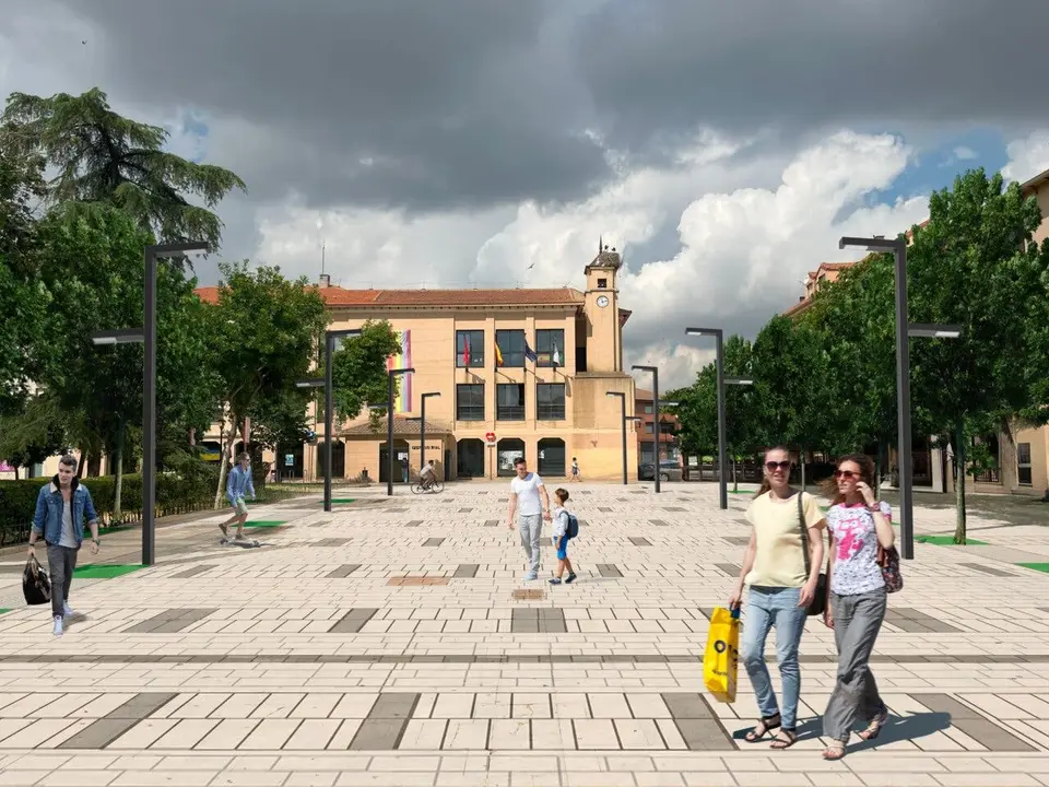 Una animada plaza con varias personas disfrutando del espacio p&uacute;blico.