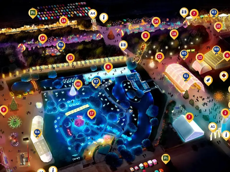 Vista a&eacute;rea del festival navide&ntilde;o iluminado con diversas atracciones.