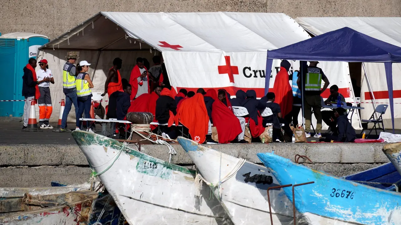 Muelle de Arguineguin, Arguineguin, Mogan, Gran Canaria, Canary Islands - 13 October 2023 - Young North African migrants assisted in Arguinegu&iacute;n port after recovery at sea by Salvamento Maritimo boats