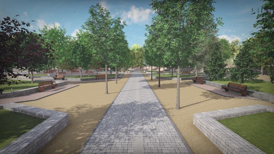 Vista del Parque Iplacea en Alcalá de Henares con árboles y caminos renovados